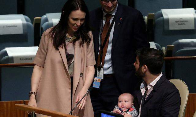 FILE PHOTO: New Zealand Prime Minister Jacinda Ardern walks back to her baby Neve and partner Clarke Gayford, after speaking at the Nelson Mandela Peace Summit during the 73rd United Nations General Assembly in New York City