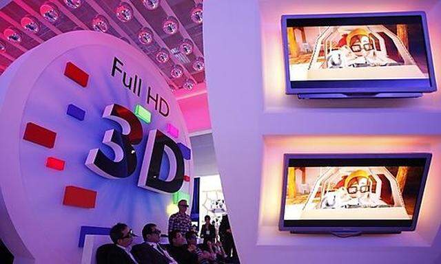 File photo of visitors watching 3D TV at IFA consumer electronics fair in Berlin