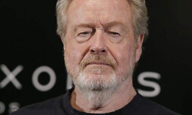 Director Ridley Scott  poses during a photocall for his film 'Exodus: Gods and Kings' in Paris