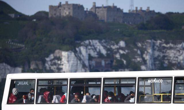 FILE PHOTO: Migrants arrive into Dover Harbour after being rescued while crossing the English Channel