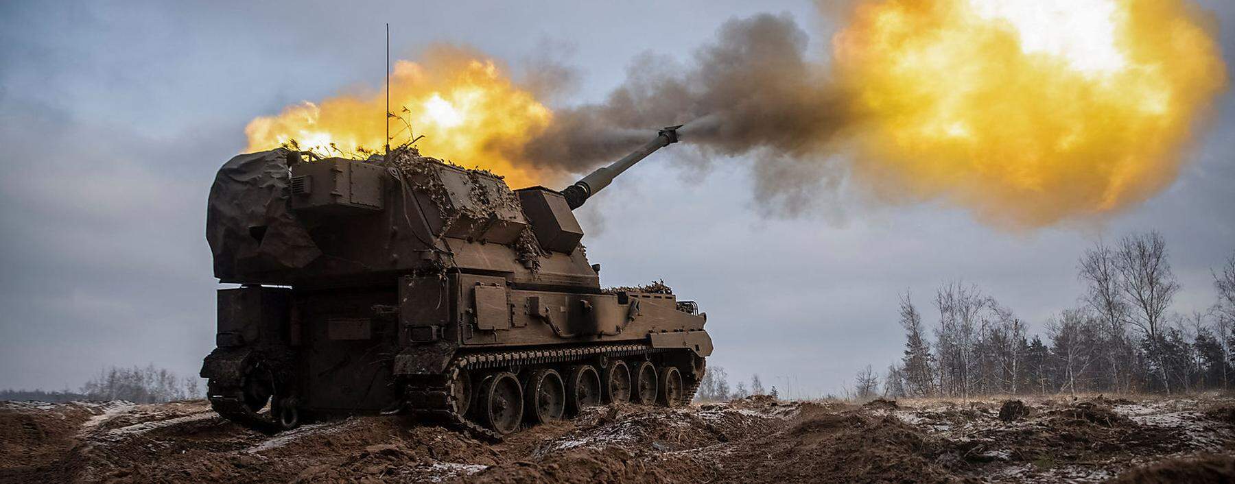 Ukrainian servicemen fire a Polish self-propelled howitzer Krab toward Russian positions on a frontline in Donetsk region