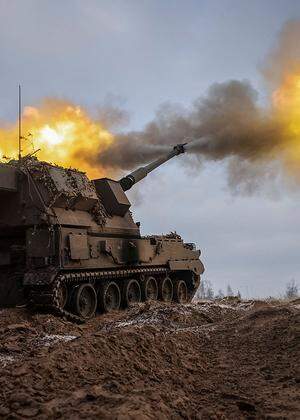 Ukrainian servicemen fire a Polish self-propelled howitzer Krab toward Russian positions on a frontline in Donetsk region