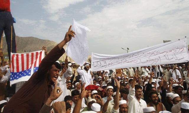 Afghan protesters shout anti-U.S. slogans during a demonstration in Jalalabad province