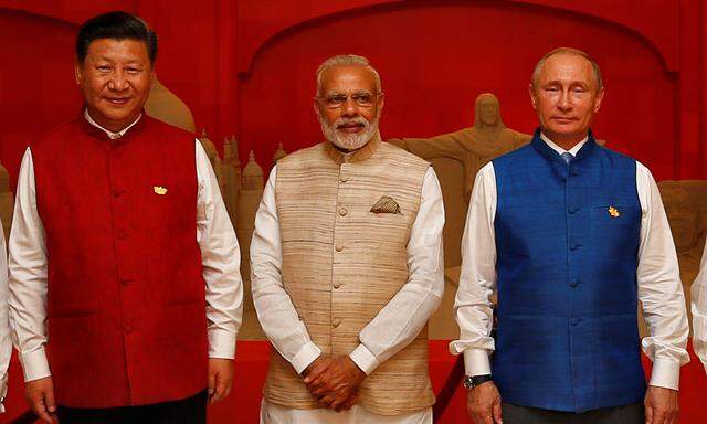 Zwei Riesen und ein Zwerg (nach der Einwohnerzahl): Chinas Xi Jinping, Indiens Narendra Modi, Russlands Wladimir Putin.