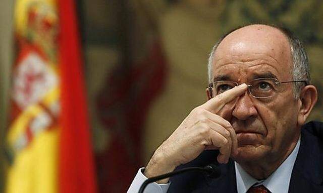 Bank of Spain Governor Miguel Angel Fernandez Ordonez gestures during a news conference in Madrid