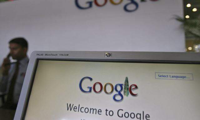 File photo of a security personnel answering a call at the reception counter of the Google office in the southern Indian city of Hyderabad