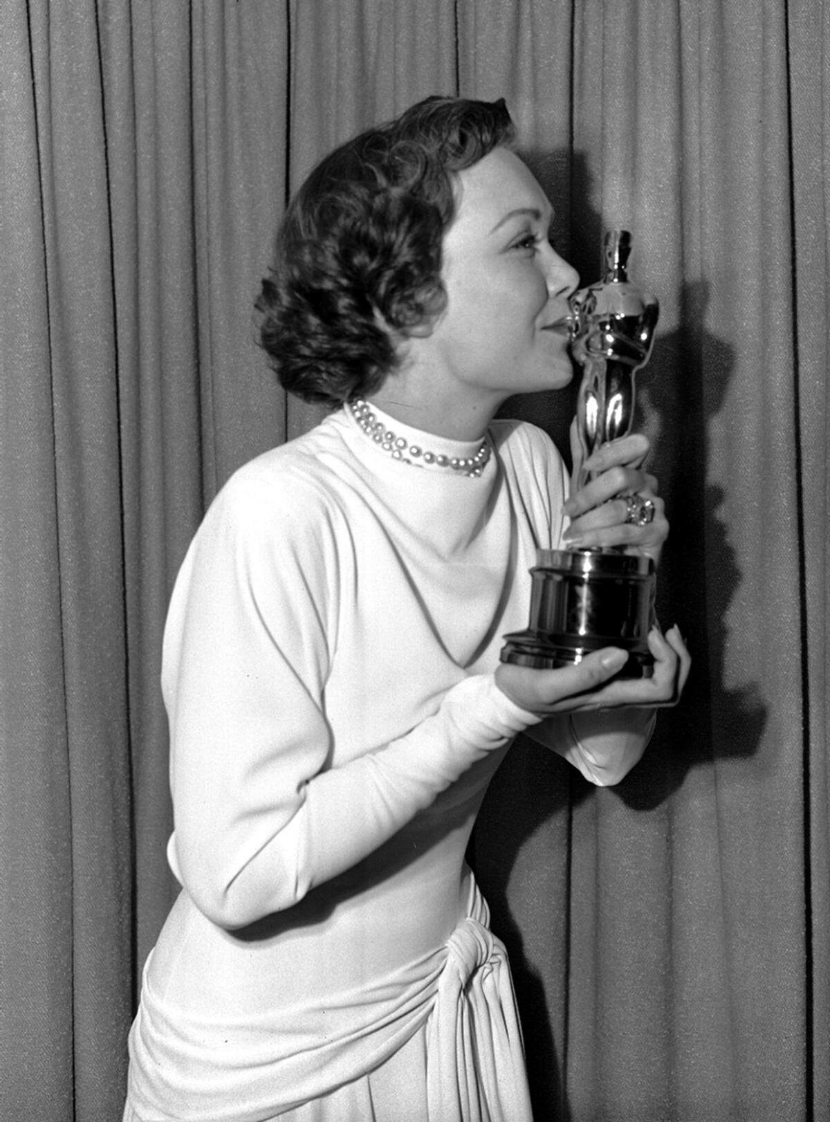Jane Wyman, Oscar-Gewinnerin im Jahre 1949, erinnert mit ihren braunen Haaren und sanften Blick an ...