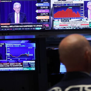 Traders work on the floor of the NYSE in New York