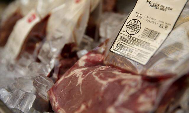 Individual packages of steak are shown with labels at a meat shop in San Francisco