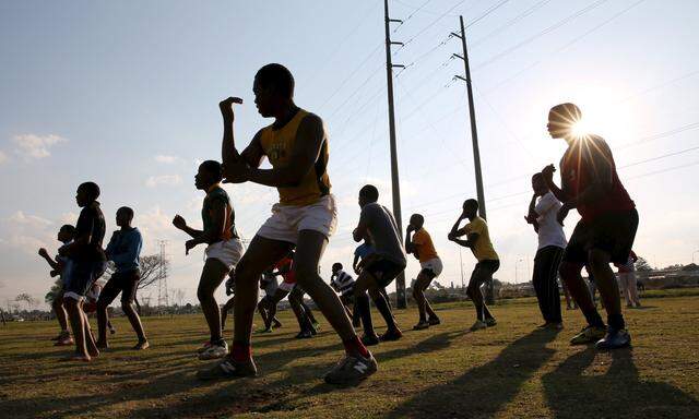 Members of the Jabulani rugby club perform the Haka during a rugby practice in Soweto
