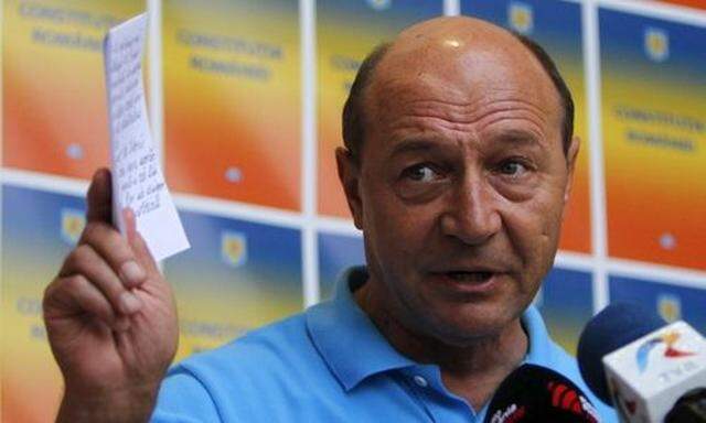 Romania's suspended President Basescu addresses the media in Bucharest