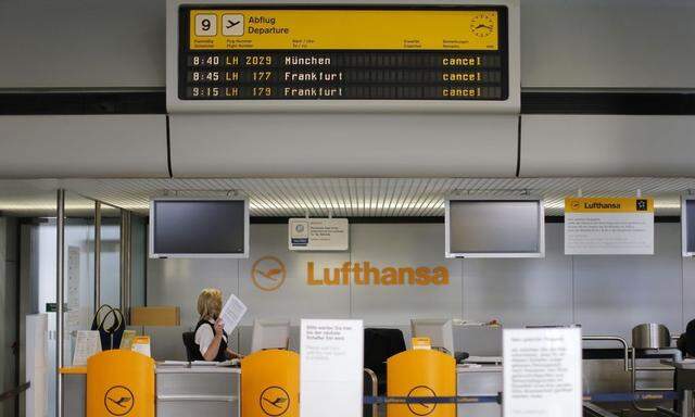 Cancelled flights are seen on a flight schedule board during a warning strike of German air carrier Lufthansa's ground personnel at Tegel airport in Berlin