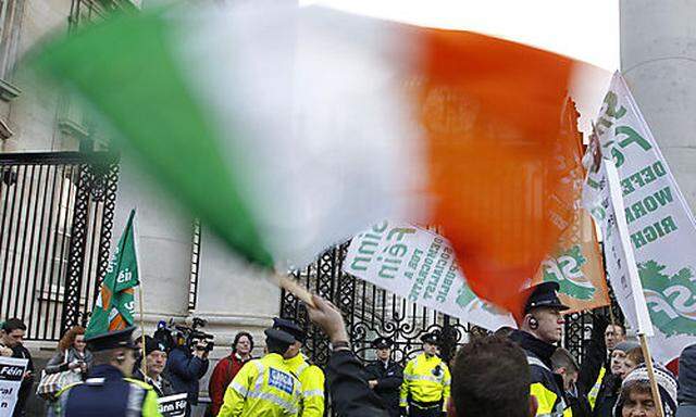 Sinn Fein hold a protest outside government buildings, Dublin, Ireland, Monday, Nov. 22, 2010 during 