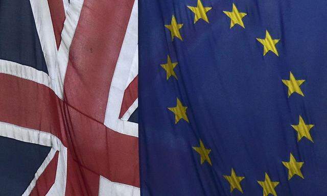 File photograph of European Union and the British Union flags flying outside Europe House in London