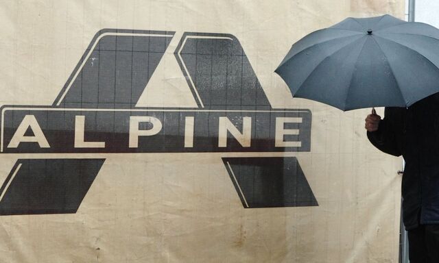 A man passes an abandoned construction site in Vienna