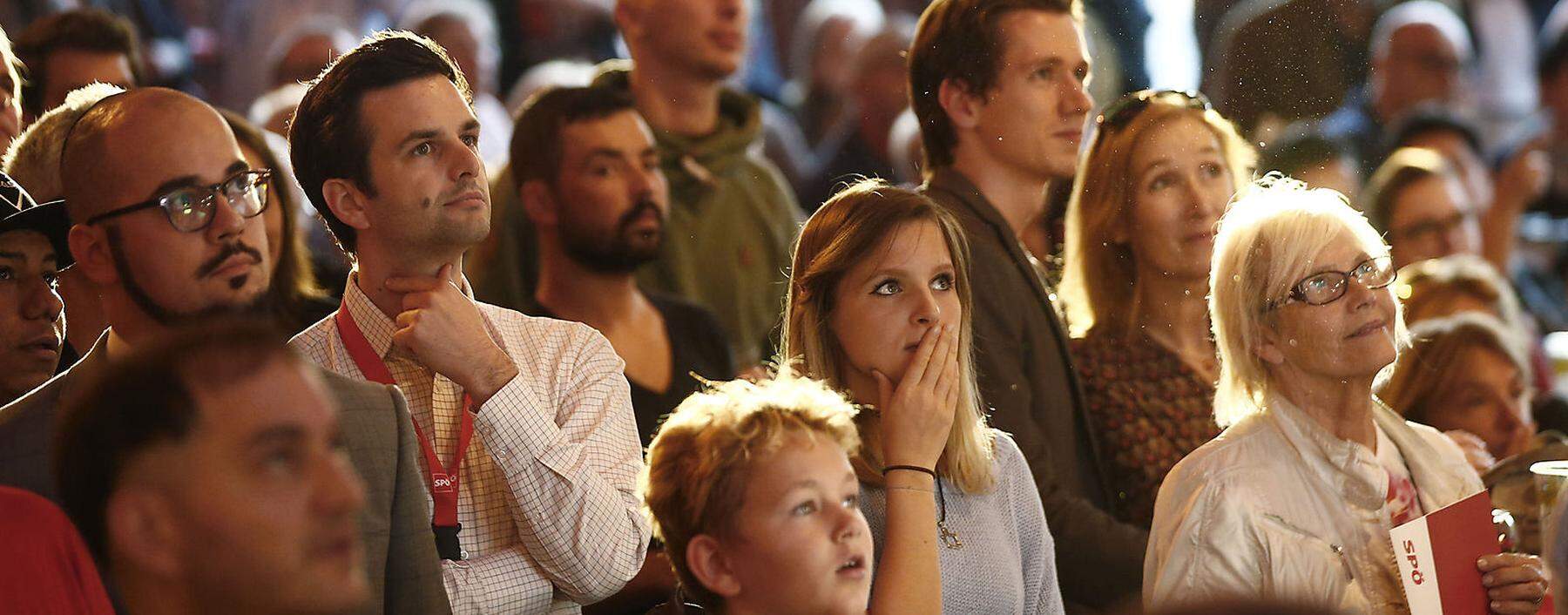 Supporters of the Social Democratic Party (SPOe) react after first exit polls in Vienna