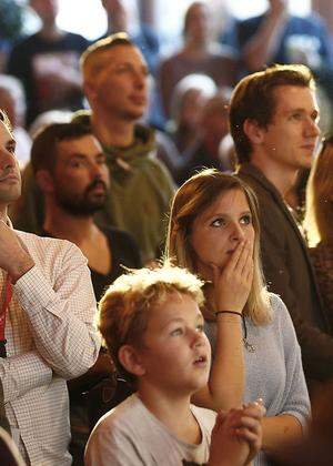 Supporters of the Social Democratic Party (SPOe) react after first exit polls in Vienna