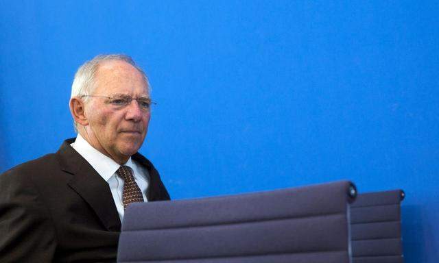 German Finance Minister Wolfgang Schaeuble arrives at news conference to present 2015 federal budget draft in Berlin