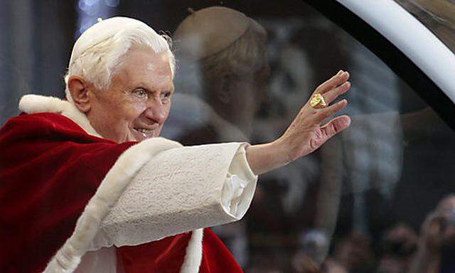 Pope Benedict XVI waves to faithful from his popemobile, in Rome, Wednesday Dec. 8, 2010. Pope Benedi