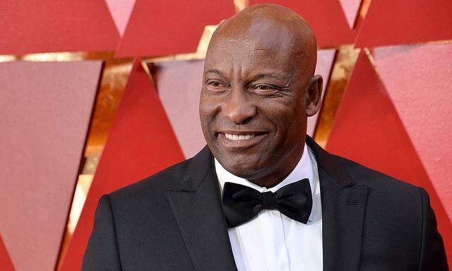 Director John Singleton arrives on the red carpet for the 90th annual Academy Awards at the Dolby T