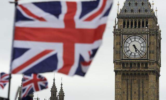 Flags are seen above a souvenir kiosk near Big Ben clock at the Houses of Parliament in central London