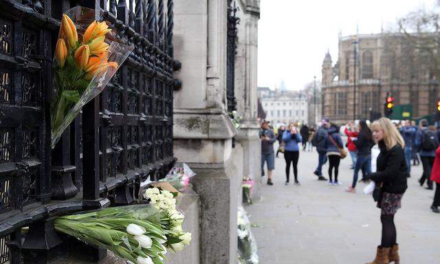 Floral tributes are pictured at the Palace of Westminster after PC Keith Palmer was murdered by Kha