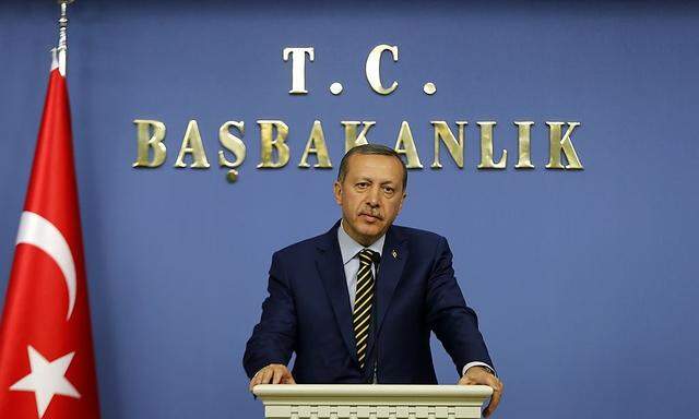Turkey's Prime Minister Tayyip Erdogan addresses the media in Ankara