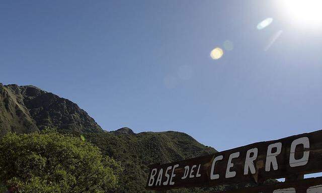 A sign marks the base of the Uritorco hill in the Argentine city of Capilla del Monte in the Cordoba