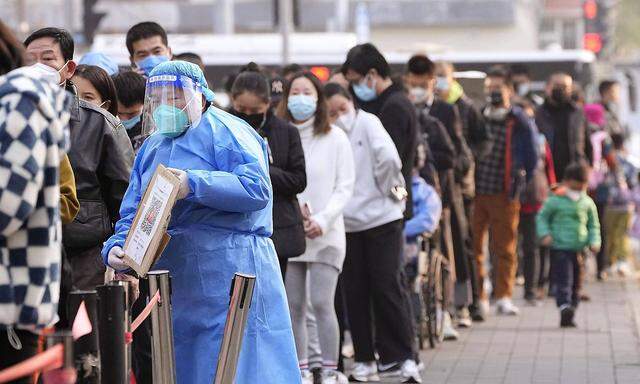 Zero COVID policy in China People line up for PCR tests in Beijing on Nov. 10, 2022, as authorities impose strict trave