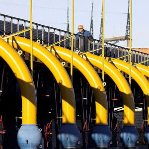 FILE PHOTO: A worker checks pipes at a gas compressor station on the Yamal-Europe pipeline near Nesvizh