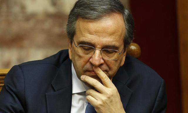 Greek Prime Minister Samaras reacts in parliament during the last round of a presidential vote in Athens