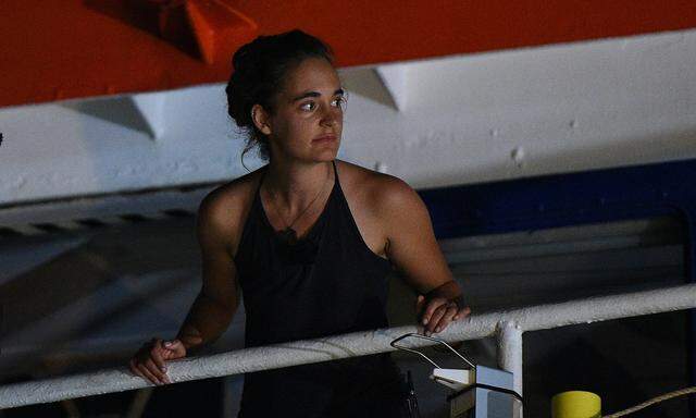 Carola Rackete, the 31-year-old Sea-Watch 3 captain, is seen onboard the ship as it docks in Lampedusa