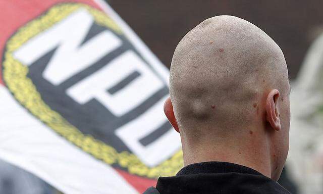 A boy attends a demonstration rally of the extreme right NPD against the Islamisation, in Duisburg