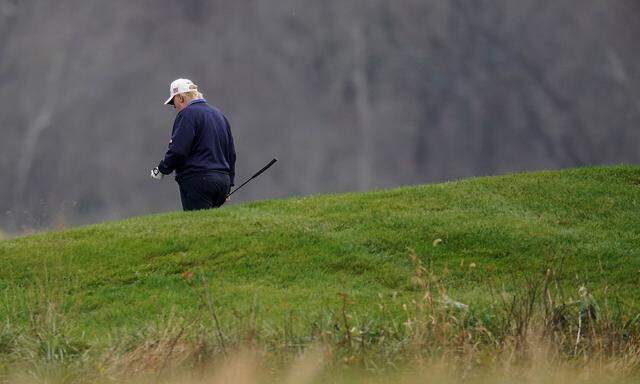 U.S. President Donald Trump plays golf at the Trump National Golf Club in Sterling, Virginia