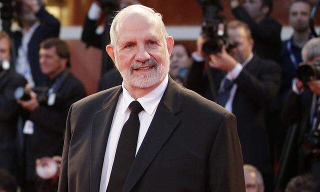 Director Brian De Palma poses on the red carpet during a screening for the movie 'Passion' at the 69th Venice Film Festival