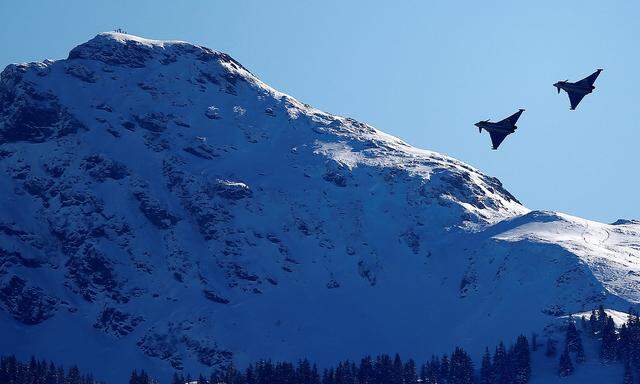 FILE PHOTO: Two Eurofighter Typhoon aircraft fly over the Streif course during an aerial exhibition before the start of the men´s Alpine Skiing World Cup Super G race in Kitzbuehel
