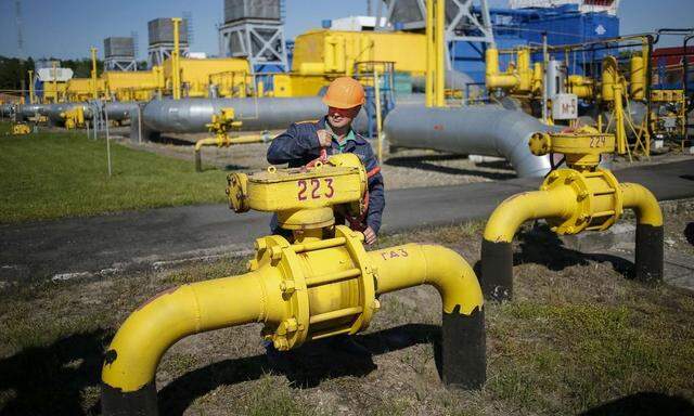 File photo of a worker turning a valve at an underground gas storage facility near Striy