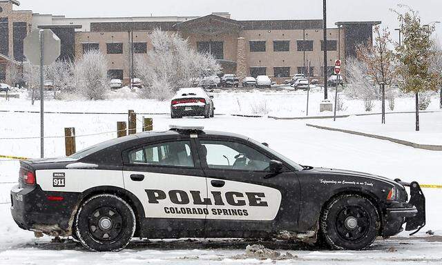 A Colorado Springs Police car blocks the entrance outside the Planned Parenthood clinic a day after a gunman opened fire in Colorado Springs