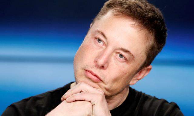 FILE PHOTO: Elon Musk at a press conference following the first launch of a SpaceX Falcon Heavy rocket in Cape Canaveral