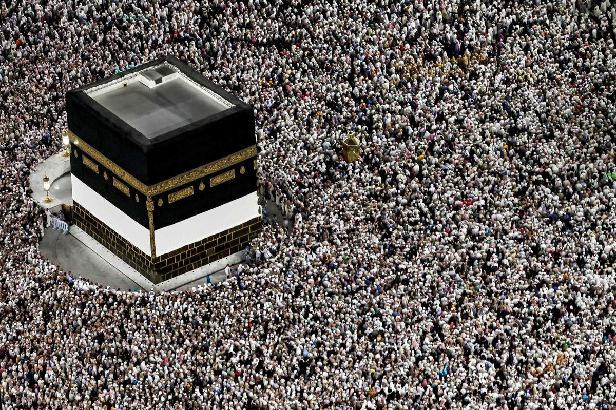 Pilgrims at the Kaaba in the courtyard of the Holy Mosque in Mecca. 