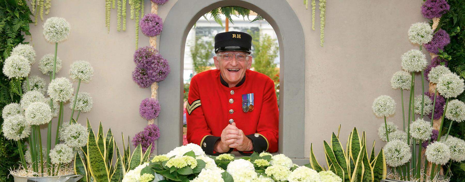 Chelsea Pensioner Paul Whittick enjoys the display on the Marks and Spencer Floral Market exhibition during press day at the RHS Chelsea Flower Show 2018 in London Monday, May 21, 2018..RHS / Luke MacGregor