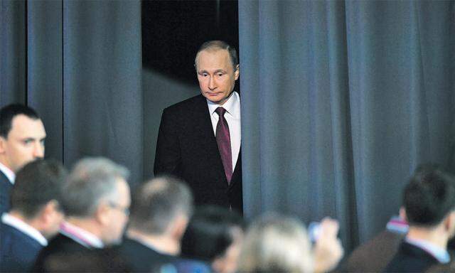 Der Mann hinter dem Vorhang. Laut US-Geheimdienst steckt Putin hinter dem Cyberangriff.