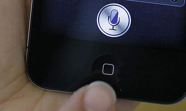 In this photo taken Monday Oct. 10, 2011, Siri, the new virtual assistant, is displayed on the new Ap