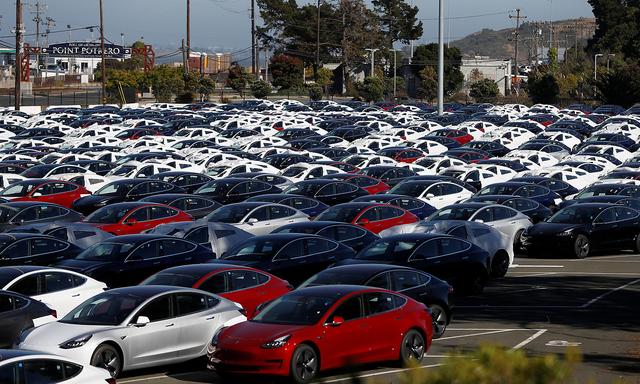 A parking lot of predominantly new Tesla Model 3 electric vehicles is seen in Richmond, California