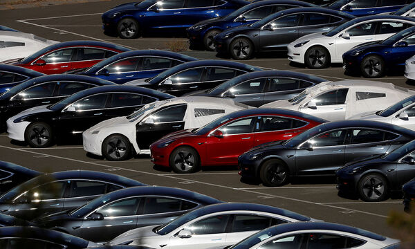 FILE PHOTO: Rows of the new Tesla Model 3 electric vehicles in Richmond