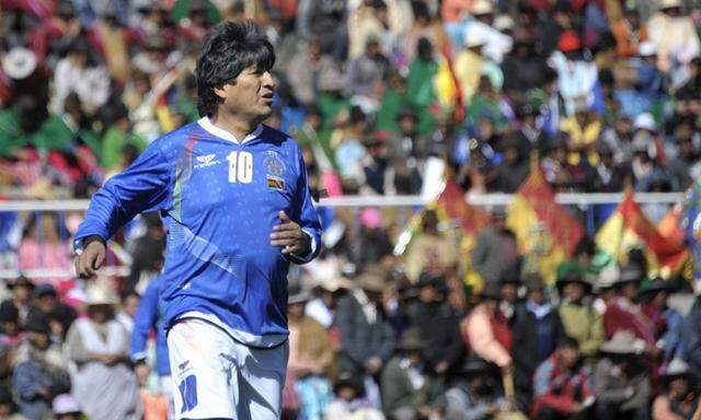 Handout photo shows Bolivia's President Evo Morales, seen during a friendly soccer match held at the inauguration of a sport field at Lake Titicaca in Copacabana