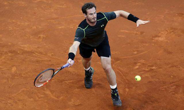 Britain's Andy Murray returns the ball to Japan's Kei Nishikori during their semi-final match at the Madrid Open tennis tournament in Madrid, Spain
