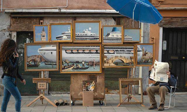 Social media picture of a street stall with oil paintings creating an image of a yacht in the Venice canal with a sign reading ´Venice in oil´, set up by a person purporting to be British artist Banksy, in Venice