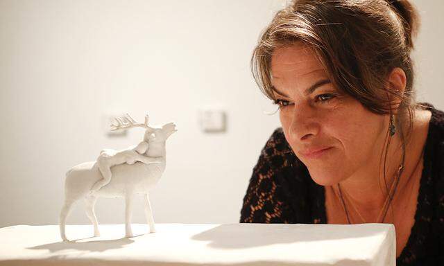 British artist Tracey Emin poses with her artwork ´I whisper to my past do I have another choice´ in Leopold Museum in Vienna