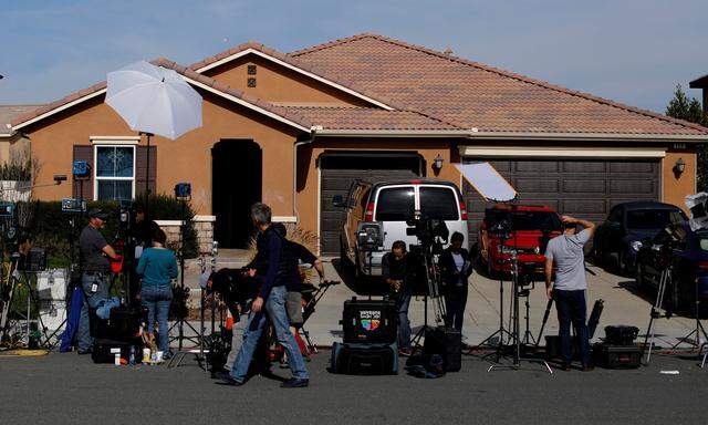 FILE PHOTO: News media gather outside the home of David Allen and Louise Anna Turpin in Perris